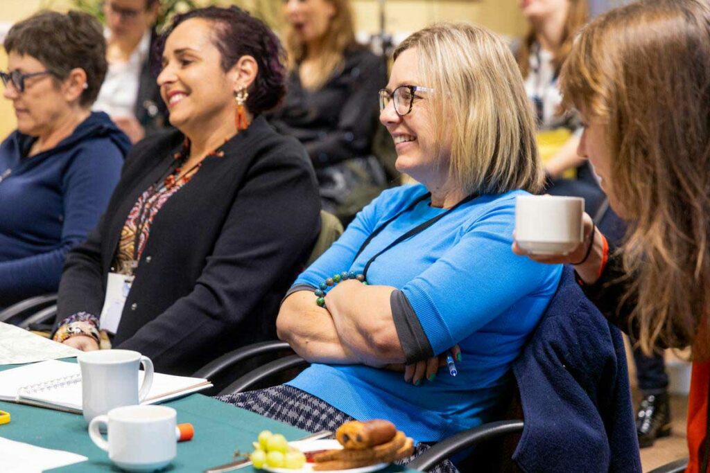 Larissa Hale and Theresa Fyffe (Queensland Indigenous Womens Ranger Network) listen to Charlot Magayi (Mukuru Clean Stoves) and Albin Wilson (Roam) take a selfie with Hindou Ibrahim