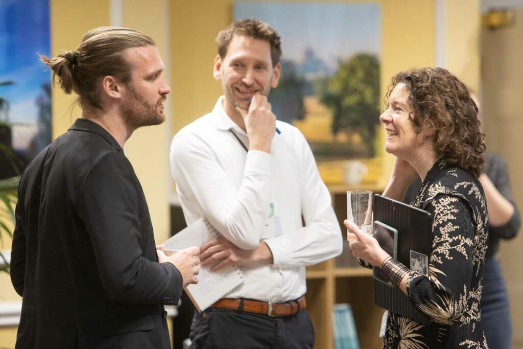 Sarah Hunter, Director of Public Policy from X company, chats with Albin Wilson (Roam) and Christiaan Norde (City of Amsterdam)