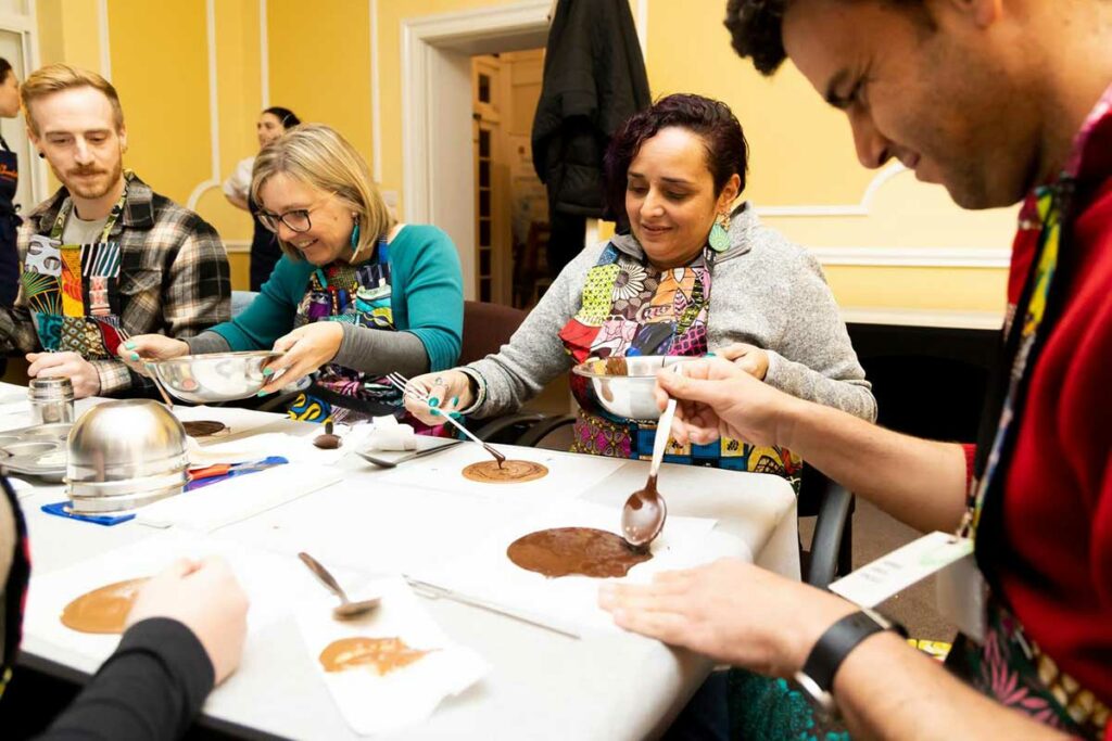 Jan Verbeek (SeaForester) and Larissa Hale & Theresa Fyffe (Queensland Indigenous Womens Ranger Network) make chocolate